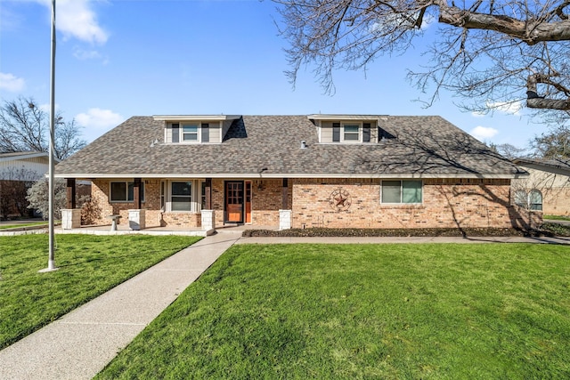 view of front facade with covered porch and a front lawn