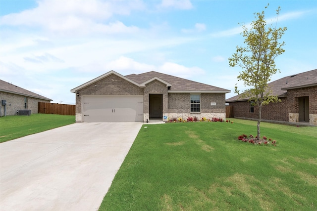 ranch-style house featuring a garage and a front lawn