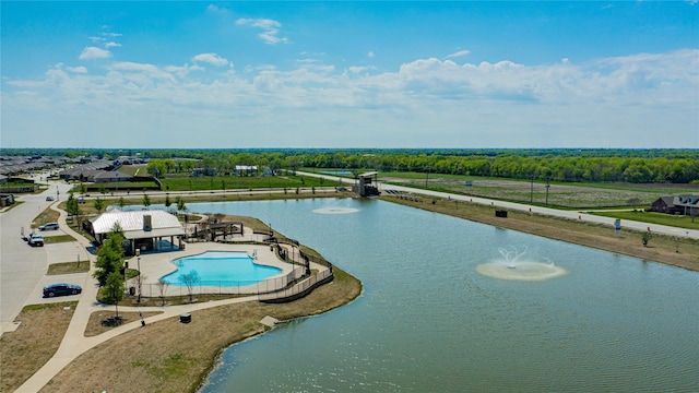 birds eye view of property with a water view