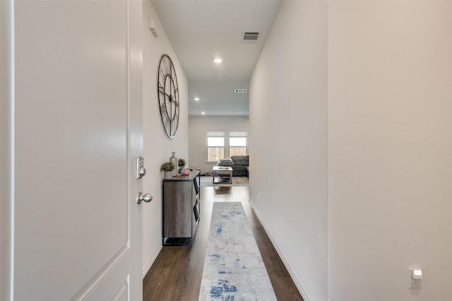 hall with dark wood-type flooring