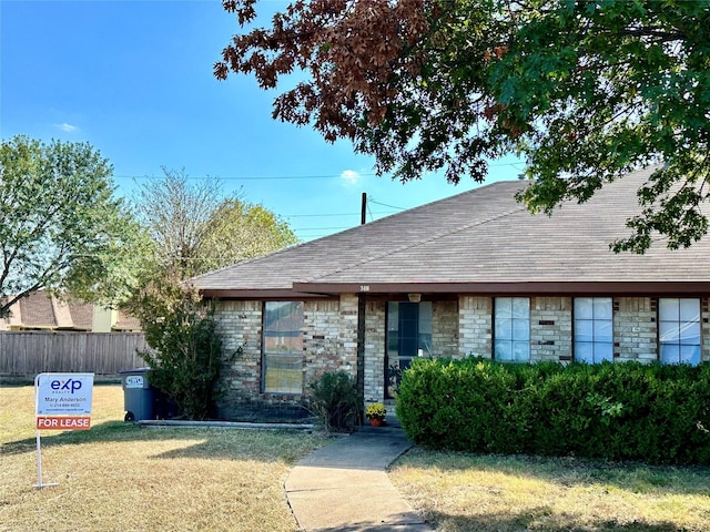 view of front of home with a front lawn