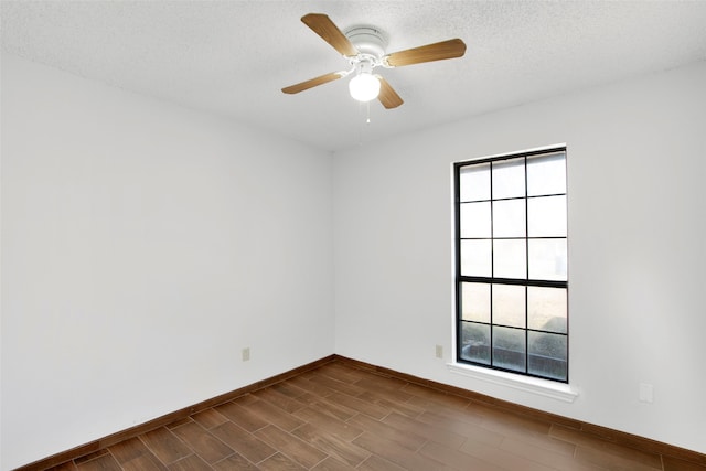 unfurnished room featuring hardwood / wood-style floors, a textured ceiling, and ceiling fan