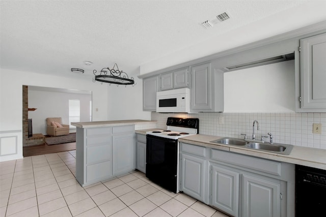 kitchen featuring gray cabinetry, sink, electric range, and dishwasher