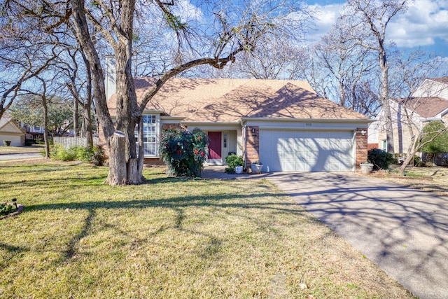 view of front of home featuring a garage and a front lawn