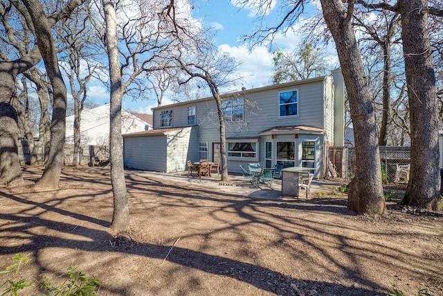 back of house with a patio area