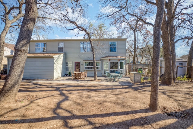 rear view of house featuring a patio