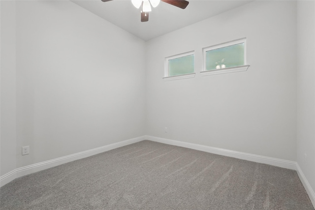 unfurnished room with ceiling fan, carpet flooring, and baseboards