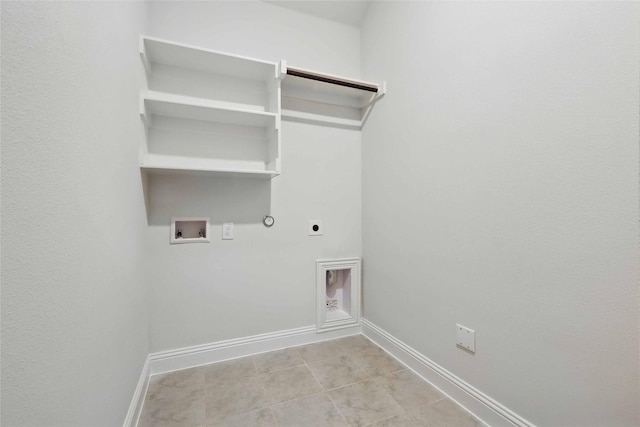 clothes washing area with baseboards, washer hookup, hookup for a gas dryer, hookup for an electric dryer, and laundry area
