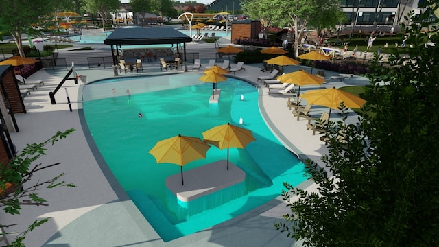 community pool featuring fence and a gazebo