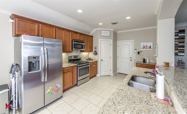 kitchen with sink, ornamental molding, stainless steel appliances, light stone countertops, and decorative backsplash