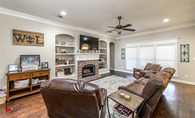 living room with ornamental molding, dark hardwood / wood-style floors, and a brick fireplace