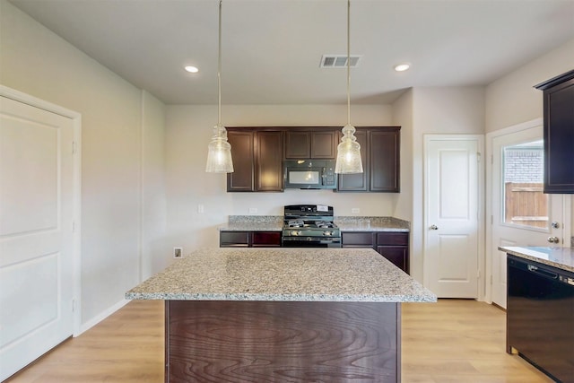 714 Gentle Bird Dr, Lavon, TX 75166 - kitchen with hanging light fixtures, visible vents, dark brown cabinetry, black appliances, and light wood-type flooring