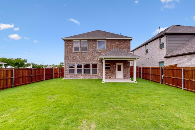 714 Gentle Bird Dr, Lavon, TX 75166 - rear view of property with a yard, a patio, brick siding, and a fenced backyard