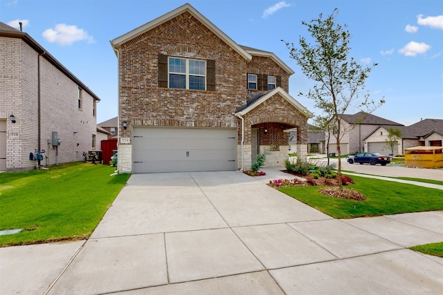 714 Gentle Bird Dr, Lavon, TX 75166 - traditional home featuring a garage, a front lawn, brick siding, and driveway