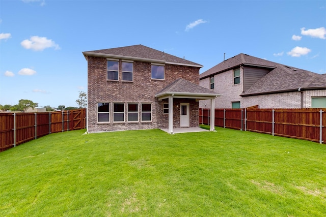 714 Gentle Bird Dr, Lavon, TX 75166 - back of property featuring a yard, a patio area, brick siding, and a fenced backyard