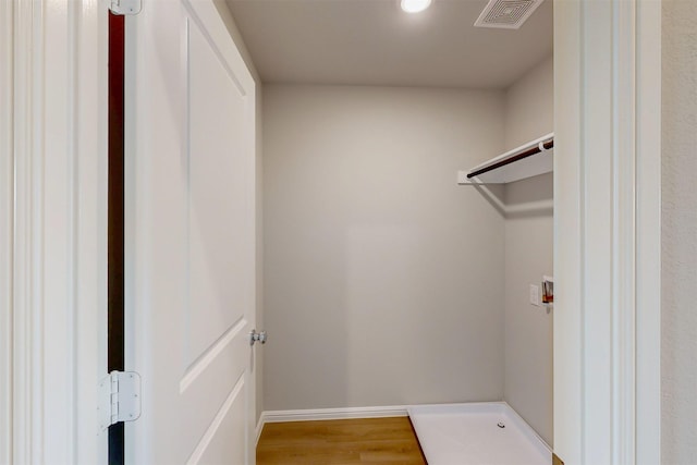 714 Gentle Bird Dr, Lavon, TX 75166 - spacious closet with visible vents and wood finished floors