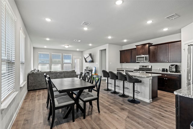 dining room featuring light wood-type flooring