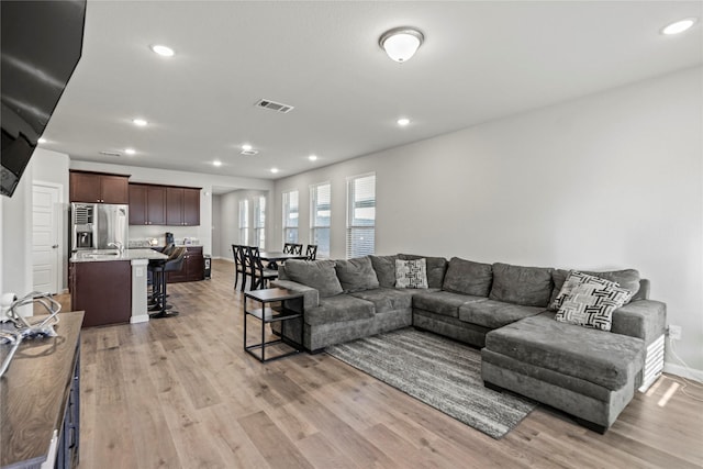 living room with light hardwood / wood-style floors