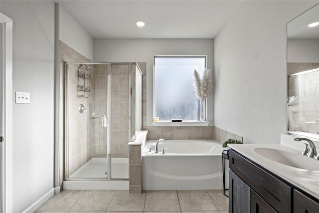 bathroom with vanity, shower with separate bathtub, and tile patterned flooring