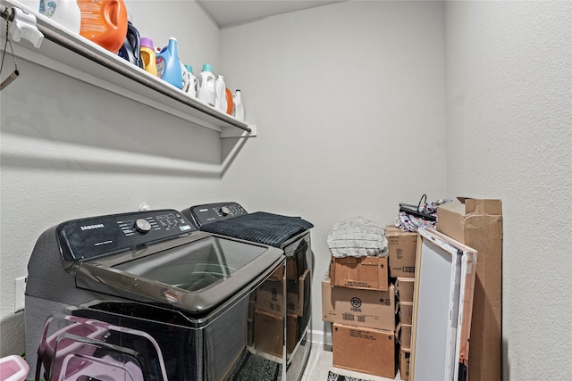 washroom with independent washer and dryer