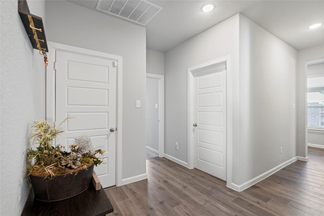 hall with wood-type flooring