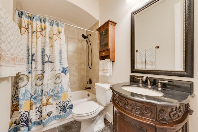 full bathroom featuring shower / tub combo, vanity, tile patterned floors, and toilet