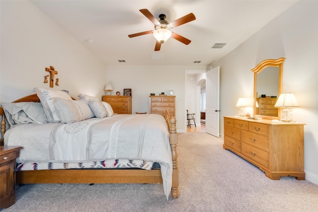 bedroom featuring light carpet and ceiling fan