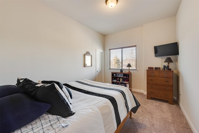 bedroom featuring light colored carpet