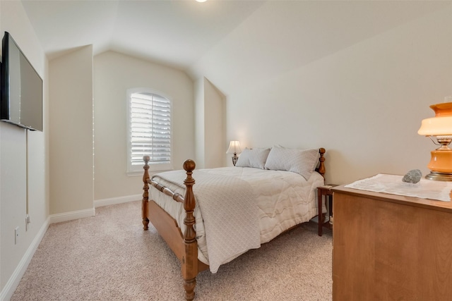 carpeted bedroom featuring vaulted ceiling