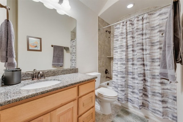 full bathroom featuring vanity, shower / tub combo, and toilet