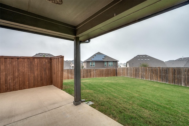 view of yard with a fenced backyard and a patio