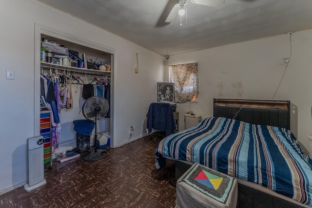 bedroom featuring ceiling fan and a closet