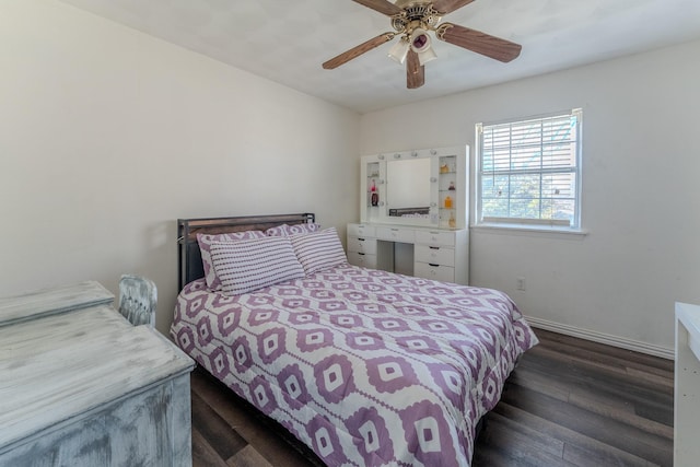 bedroom with dark hardwood / wood-style flooring and ceiling fan