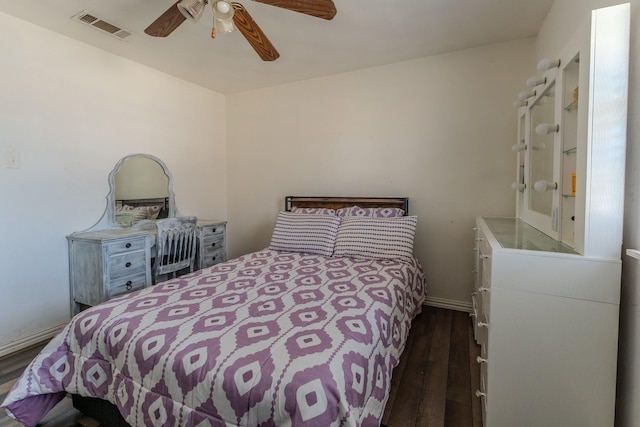 bedroom featuring dark hardwood / wood-style flooring and ceiling fan