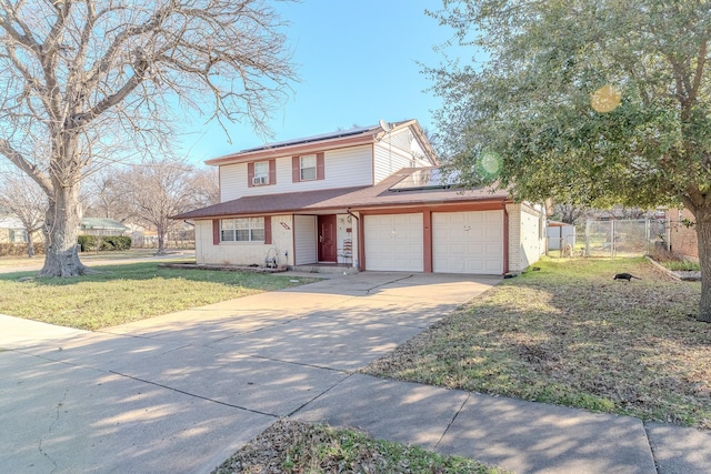 front facade featuring a garage and a front yard