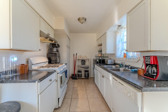 kitchen featuring sink, white cabinetry, light tile patterned floors, white appliances, and backsplash