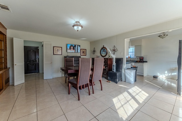 dining space with light tile patterned flooring