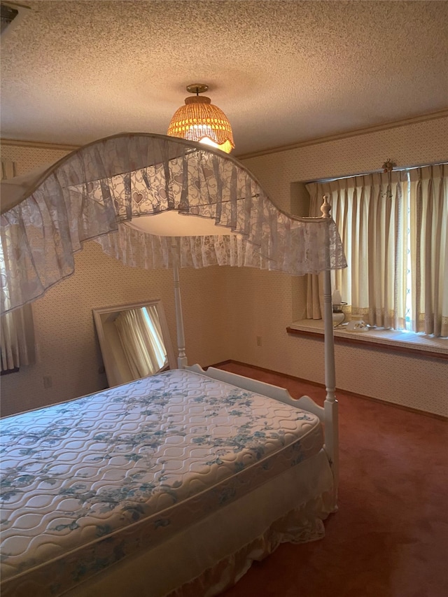 unfurnished bedroom featuring carpet floors and a textured ceiling