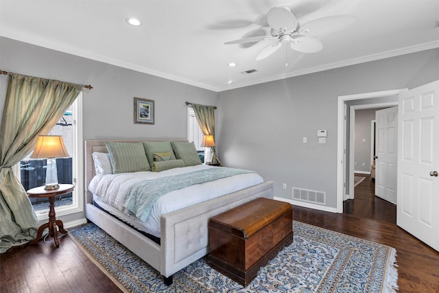 bedroom with multiple windows, ornamental molding, and dark hardwood / wood-style floors