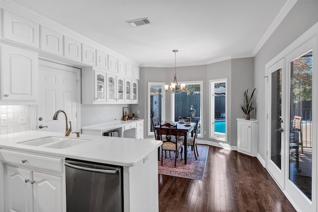 kitchen with dark wood-style floors, glass insert cabinets, white cabinetry, a sink, and dishwasher