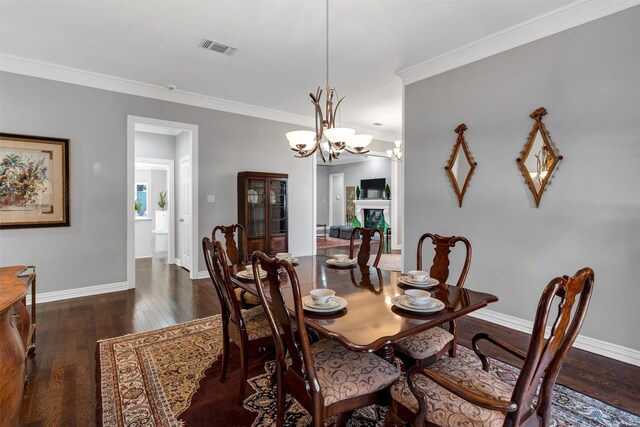 kitchen featuring sink, a center island, ornamental molding, white cabinets, and kitchen peninsula