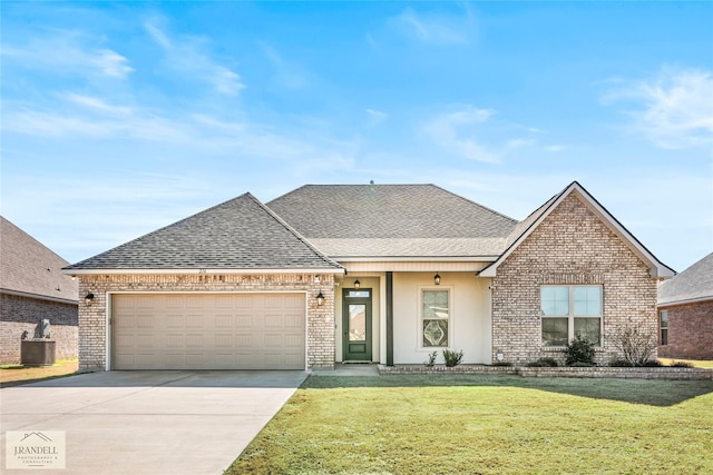 view of front of house with a garage, a front yard, and central air condition unit