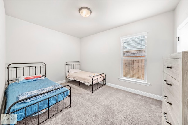 bedroom featuring light carpet