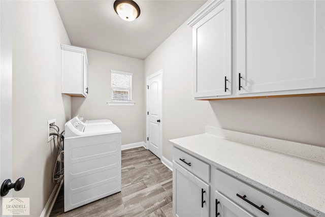 laundry area with cabinets, washer hookup, and light wood-type flooring