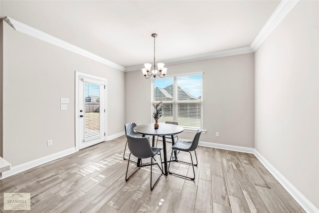 dining area with an inviting chandelier, crown molding, and light hardwood / wood-style flooring