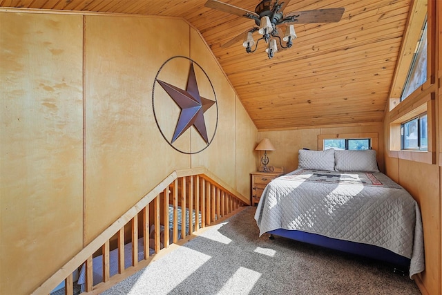 bedroom with high vaulted ceiling, wooden ceiling, rail lighting, and wood walls