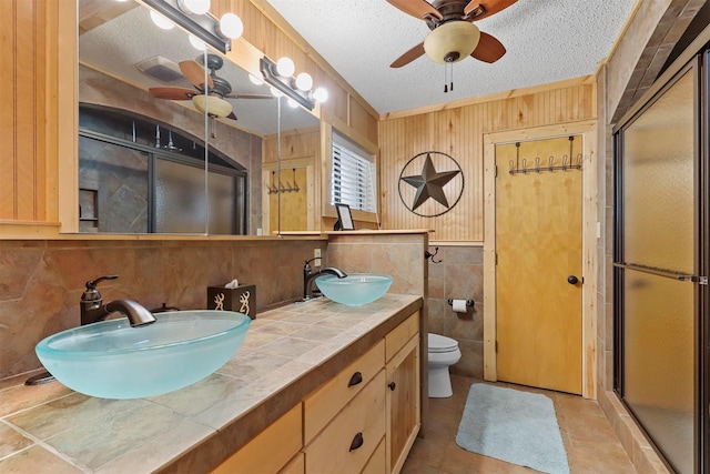 bedroom featuring lofted ceiling with beams, track lighting, wooden ceiling, and an AC wall unit