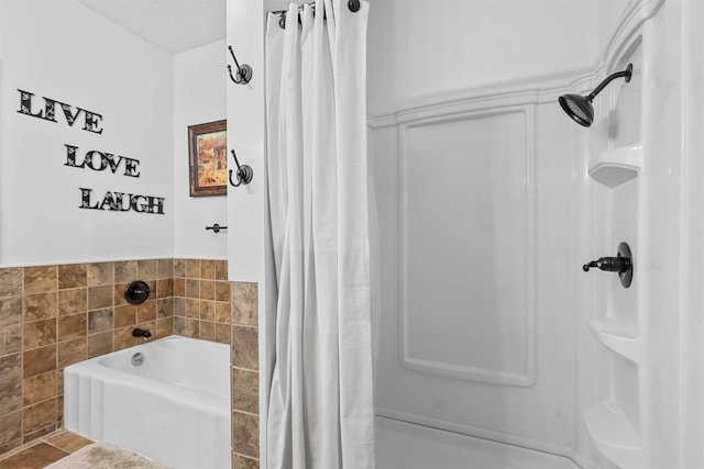 bathroom featuring walk in shower, ceiling fan, vanity, and a textured ceiling