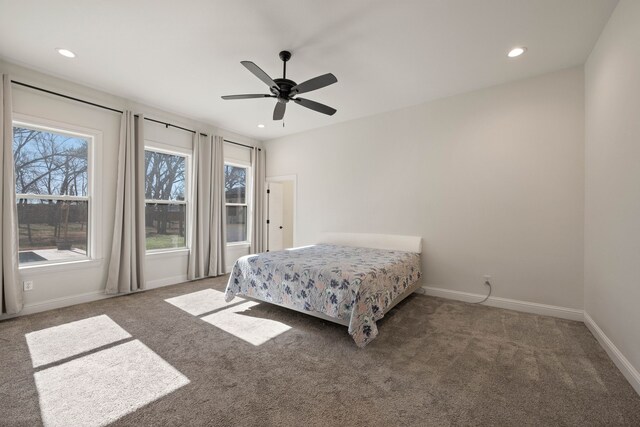 carpeted bedroom with ceiling fan