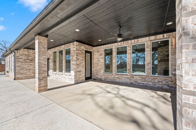 back of property with a fenced in pool, a patio, and a lawn